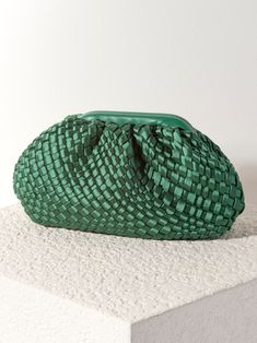 Stand out this season with Shiraleah’s chicest new fall handbag, the Bailey Clutch. This classic clutch silhouette comes in a vibrant green color and is elevated by its woven satin texture with a sleek, magnetic frame top closure. Just under a foot long with a roomy interior, it is the perfect size to carry all of your essentials in hand during a night out. Pair with other items from Shiraleah to complete your look! Shiraleah is a trend-driven lifestyle brand focused on the little gifts that mak Woven Clutch For Evening, Chic Green Pouch Evening Bag, Chic Woven Clutch For Party, Chic Woven Clutch For Formal Occasions, Trendy Green Clutch For Formal Occasions, Chic Woven Clutch Evening Bag, Woven Clutch For Evening In Spring, Chic Green Clutch Evening Bag, Chic Green Evening Bag