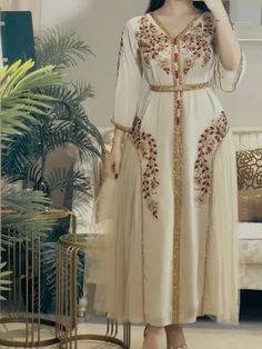 Introducing our exquisite Chiffon Embroidery Long Sleeve Abaya, a sophisticated garment perfect for Ramadan and Eid celebrations. Crafted from lightweight chiffon fabric, this abaya offers both elegance and comfort for the modern Muslim woman. The intricate embroidery detailing adds a touch of refinement and cultural flair, making it a standout piece for special occasions.Designed with modesty and style in mind, this long sleeve abaya is versatile enough to be worn for a variety of events. Wheth Chiffon Evening Dresses, Muslim Dress, Evening Dress Fashion, Full Dress, Women's Evening Dresses, Evening Dresses Elegant, Types Of Skirts, Collar Dress, Chiffon Fabric