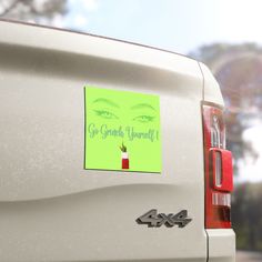 a sticker on the back of a car with an image of a woman's eye