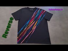 a black shirt with multicolored beads on it