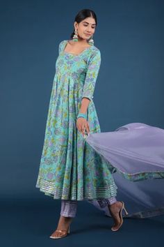 Aqua green anarkali with spring print and metallic panels. Paired with pant and printed hem dupatta.
Component: 3
Pattern: Printed
Type Of Work: Spring
Neckline: Square
Sleeve Type: Three Quarter
Fabric: Anarkali and Pant: Cotton, Dupatta: Organza
Color: Green
Other Details: 
Printed hem dupatta
Back tassel tie-up
Occasion: Puja - Aza Fashions Festive Green Salwar Kameez With Printed Border, Green Anarkali Kurta With Printed Border, Pista Green Anarkali Set With Printed Motifs, Green Salwar Kameez With Printed Border For Eid, Fitted Green Anarkali Set With Printed Motifs, Anarkali Green Churidar With Printed Motifs, Green Cotton Anarkali Set, Festivals Anarkali Churidar With Printed Border, Festival Anarkali Set With Printed Border