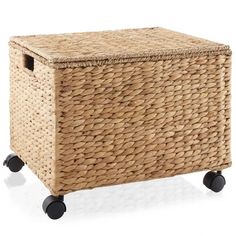 a wicker storage box on wheels with black casteors and an opening for the lid