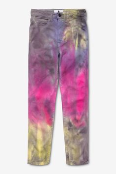 a pair of pants with pink, yellow and blue dye on them sitting on top of a white surface