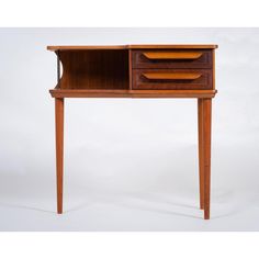 an old wooden desk with two drawers on one side and a drawer on the other