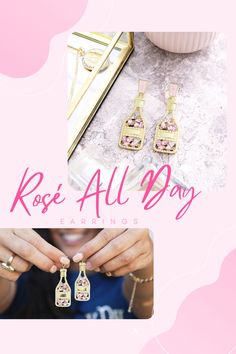 rose all day earrings with pink flowers on them and the words rose all day written in gold