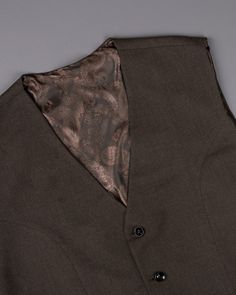 Create a lasting impression in this impeccably tailored coffee bean brown Waistcoat from French Crown. Crafted with premium cotton, this Waistcoat is perfect for all your board meetings and official dinners. Pair it with a black shirt and monk to get a perfect formal look. In addition to being constructed from Imported Superior Fabrics, French crown Waistcoats are built with top quality components and thoughtful construction. 100% Premium Cotton Features Padded shoulder for a formal silhouette 5 Brown Waistcoat, Brown Texture, Buy Coffee, Coffee Bean, Outfit Style, Formal Looks, Coffee Beans, Custom Fit, Black Shirt