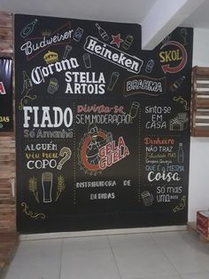 a blackboard with some different types of food on it in front of a store