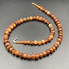 The beautiful carnelian mala necklace along with some small carnelian beads spacers The age of this beads are more than 2000 years old carnelian and old agate was used in ancient times in prayer mala and in jewelry necklaces we provide fast and free shipping service world wide Amber Carnelian Necklace With Polished Beads, Brown Carnelian Gemstone Necklaces, Brown Carnelian Gemstone Necklace, Amber Oval Beads Gemstone Necklace, Amber Beaded Necklaces With Natural Stones For Healing, Brown Gemstone Necklaces With Round Beads, Amber Necklace With Oval Gemstone Beads, Brown Agate Gemstone Beaded Necklaces, Artisan Amber Necklace Single Strand