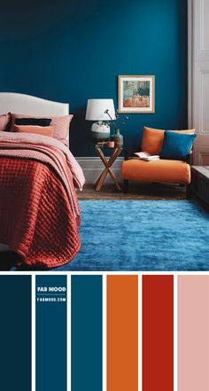 a bedroom with blue walls and orange accents