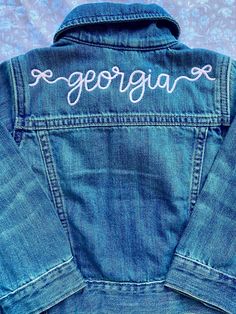 Personalized jean jacket with fun bright lettering! Great for all seasons! Jackets are true to size! Fun Cotton Denim Jacket For Fall, Fun Cotton Outerwear For Spring, Fun Spring Denim Jacket, Fitted Cotton Outerwear With Letter Print, Fun Cotton Outerwear For Fall, Cute Medium Wash Cotton Outerwear, Fitted Fall Denim Jacket With Letter Print, Spring Cotton Outerwear With Letter Print, Custom Embroidered Cotton Outerwear For Fall