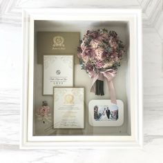 a wedding suite in a box with flowers