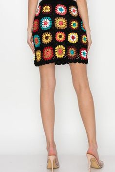 So special and one-of a kind this crocheted skirt features a classic multicolored stitched pattern, pull-on style stretch fit. Acrylic Spring Crochet Mini Skirt, Spring Mini Skirt With Crochet Details, Casual Fitted Crochet Skirt, Multicolor Cotton Mini Skirt With Lining, Spring Crochet Multicolor Bottoms, Spring Multicolor Crochet Bottoms, Casual Fitted Skirt With Crochet Trim, Multicolor Mini Length Lined Skirt, Multicolor Crochet Dress With Crochet Trim For Spring