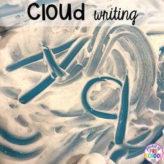 the words cloud writing written in blue and white frosting on top of a cake