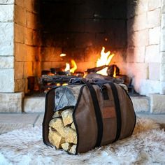 a duffel bag filled with logs sitting in front of a fireplace