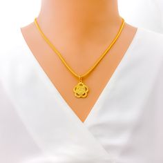 Immerse in the elegance of this Khanda pendant adorned with a delightful floral design. Crafted in 22k yellow gold, it weighs 1.7 grams and has a pendant length of 1". Its exquisite craftsmanship and brilliant finish make it a cherished accessory. Chain not included. PRODUCT DETAILS Gold Purity(karat): 22k Gold Weight(grams): 1.7 Item Finish: Yellow Gold Pendant Length: 1" Chain: Not Included Elegant Yellow Necklace For Puja, Traditional Yellow Gold Flower Pendant Necklace, 22k Yellow Gold Flower Pendant Jewelry, 22k Gold Yellow Necklace With Round Pendant, Yellow 22k Gold Necklace With Round Pendant, Yellow 22k Gold Round Pendant Jewelry, Yellow 22k Gold Pendant Necklace, 22k Yellow Gold Flower Pendant Necklace, Gold Flower Pendant Necklace In 22k