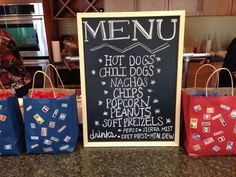 three bags are sitting on the counter in front of a chalkboard sign that says menu