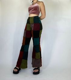 Patchwork flares featuring an assortment of colors. Colorings and patterns will vary slightly in each pair! Model is 5’2 and wearing a size S/M. Earthy Punk Outfits, Multicolor Festival Pants For Fall, Multicolor Patchwork Bottoms For Fall, Fall Multicolor Patchwork Bottoms, Retro Multicolor Bottoms With Patchwork, Fitted Patchwork Bottoms For Festival, Fitted Brown Bottoms With Patchwork, Clothing Astethic, Flare Multicolor Pants For Festival