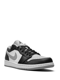 a black and white sneaker on a white background