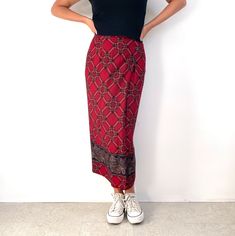 Beautiful vintage wrap style maxi skirt in red and black check and paisley border. It has a simple, straight shape with a front wrap part, which fastens with one inside button and three, shiny black buttons on the side. The skirt is made from smooth, soft rayon and is fully lined. A stunning, smart wrap skirt with a folksy vibe, great with flip-flops, flat shoes or dressed up with high heels. Made in USA by Intriguing Threads. 100% rayon. 100% acetate lining. Labelled as size 8 (US?). Would fit Red Fitted Maxi Bottoms, Long Summer Skirt, Maxi Wrap Skirt, Paisley Border, Long Skirt Summer, Maxi Skirt Style, Wrap Maxi Skirt, Summer Skirts, Black Button