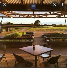 an outdoor seating area with tables and chairs