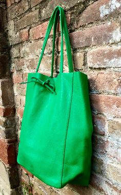 Large tote leather bag in GREEN. Leather shopper in Green closed with 2 leather straps at the top. Large enough for laptops, tablets, books etc. Natural GENUINE leather. The inside of the bag is not lined (although properly finished!). We added a small leather pouch on the inner part of the bag Excellent quality, soft but strong genuine leather. Width upper part: 41cm - 16 inch Height: 38 cm - 15 inch This listing is for the bag in GREEN ( first 4 pics). Also avalable in taupe, beige, black, bro Green Hobo Bag With Adjustable Strap For On-the-go, Green Leather Bag With Adjustable Strap, Green Rectangular Leather Bag, Modern Green Shoulder Bag With Large Capacity, Green Satchel With Leather Handles For On-the-go, Green Bags For Everyday Use, Everyday Green Bag With Removable Pouch, Green Shoulder Satchel For Everyday Use, Everyday Large Capacity Green Bag