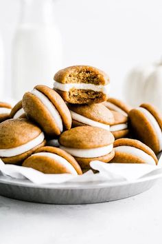 a plate full of cookies with white frosting