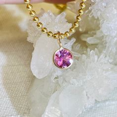 Featuring a natural and earthmined tourmaline with a gorgeous pink hue, and a round brilliant cut The fine gem is bezel wrapped solid 14K yellow gold with a round bail on top.  The bail has a 3mm inner diameter, round, but can be squeezed a little bit to make it more oval if necessary. The pendant is 9mm long x 6mm wide It can be worn alone or paired with another pendant. Gold Jewelry With Pink Sapphire, 14k Gold Pink Gemstone Jewelry, Pink 14k Gold Jewelry With Gemstone Accents, Gold Jewelry With Round Cut Pink Sapphire, Pink 14k Gold Jewelry With Bezel Setting, Gold Tourmaline Jewelry With Bezel Setting, Pink 14k Gold Round Cut Jewelry, 14k Gold Pink Solitaire Jewelry, Round Pink Sapphire Jewelry In Pink Gold