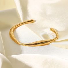 ✦ Add a touch of simple elegance to your wrist with our 18K Gold Plated Titanium Bangle Bracelet. This cuff bangle bracelet features an open cuff design that fits comfortably on any wrist, making it perfect for everyday wear. The 18K gold plating adds a touch of luxury and elegance, making it perfect for dressing up or down. The simple and minimalist design of this open bracelet allows it to be layered with other jewelry or worn on its own, making it a versatile and timeless addition to your jew Elegant Adjustable Cuff Bracelet With Open Ring, Elegant Adjustable Open Ring Cuff Bracelet, Open Bangle Bracelet, Wedding Bride Jewelry, Open Cuff Bracelet, Wrist Jewelry, Basic Jewelry, Gold Plated Bangles, Open Bangle