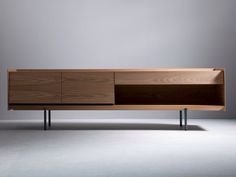 the sideboard is made out of wood and has two metal legs on each side