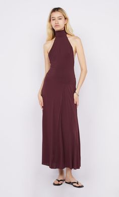 The BEC + BRIDGE Cassian Racer Dress in Deep Plum embodies elegance in a modern silhouette. Featuring a glamourous high halter neckline that falls into a dramatic open back with racer style cut-out details. Bring yours along to your next European adventure, or simply wear to dinner with friends. BEC + BRIDGE Cassian Racer Dress High halter neck maxi dress Designed to hold the bodice, before falling into draped skirt Dress is fully lined and secured by hook and eye detail at the neckband Fabric o Fitted Halter Neck Dress For Prom, Fitted Halter Neck Maxi Dress For Gala, Fitted Halter Neck Backless Dress For Formal Occasions, Fitted High Neck Backless Dress For Formal Occasions, Fitted Halter Neck Dress For Formal Occasions, Formal Fitted Backless Halter Neck Dress, Fitted Halter Neck Evening Dress For Date Night, Formal Fitted Halter Neck Maxi Dress, Formal Halter Dress With Fitted Bodice