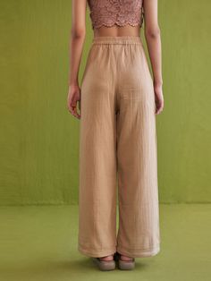 VALUES Handcrafted Organic Fair Minimal Waste CURATOR'S NOTE Fitted, wide-leg trousers crafted in azo-free dyed, double gauze organic cotton fabric. A classic pair of trousers are a perfect everyday go-to piece you can pair with shirts, crop tops, kurtas and more. THE DESIGNER STORY "Sui" is the new endeavor of the brand Sue Mue. A budding label, that aims to weave together our love for travel and connection with design. The brand believes in an optimistic and responsible fashion, that our world Relaxed Cotton Wide-leg Harem Pants, Relaxed Cotton Ankle-length Wide Leg Pants, Relaxed Cotton Wide Leg Ankle-length Pants, Relaxed Ankle-length Cotton Wide Leg Pants, Casual Wide Leg Bottoms In Natural Color, Beige Cotton Wide Leg Pants, Summer Wide Leg Bottoms In Natural Color, Natural Color Wide-leg Summer Bottoms, Natural Cotton Bottoms For Spring