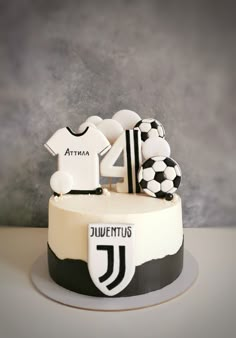 a soccer themed cake with the number four on it