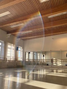 the sun shines brightly in an empty dance studio