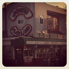 an old building with many signs on it