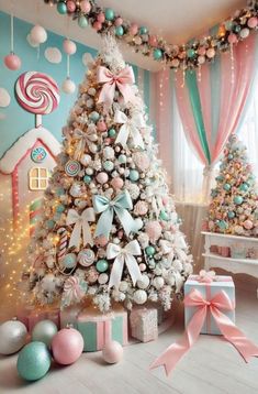 a christmas tree decorated with pastel colors and bows in front of a candy themed wall