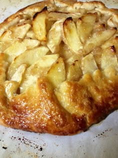 an apple pie sitting on top of a table