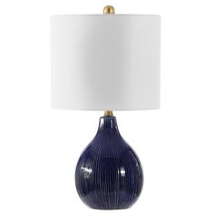 a blue table lamp with a white shade