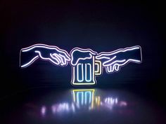 two hands reaching out to each other over a beer mug with neon lights in the dark