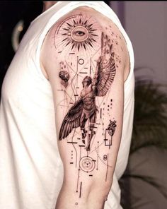 a man with a tattoo on his arm that has an image of a bird and the sun