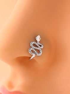 an earring with a snake on it