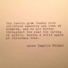 an old typewriter with the words our hearts grow tender with childhood memories and love of kindred, and we are better living in spirit