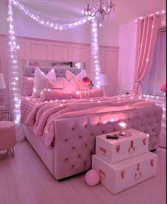 a bedroom with pink lights and a bed