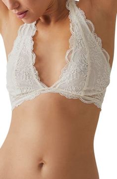 This sultry lace bra is designed in a halter silhouette with sweet scallop trim. Halter neck Partially lined 90% nylon, 10% spandex Hand wash, line dry Imported Elegant Triangle Top Bra With Lace Trim, Fitted Lace With Built-in Bra, White Fitted Feminine Halter Top, Fitted Lace Trim Bra For Wedding, Delicate Fitted Bra With Delicate Straps, Elegant Triangle Top Bra With Delicate Lace, Fitted Low-cut Lace Bra, Feminine Bra With Lace Closure, Lace Stretch Bra