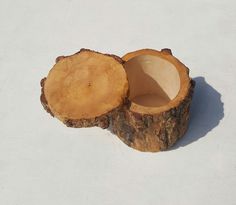 two pieces of wood sitting on top of a white surface