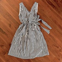 Navy Blue And White Striped Dress With Tie/Wrap Top. There Is Lining Layer Underneath. Brand New, Never Worn. The Tag Is From Main & Downy, A Local Boutique. *Fits More Like A Medium* Summer Dress With Tie Waist And Surplice Neckline, Striped V-neck Dress With Tie Waist, White V-neck Wrap Dress For Vacation, White Summer Dress With Surplice Neckline, White Wrap Dress With Tie Waist And Surplice Neckline, White Wrap Dress With Surplice Neckline And Tie Waist, White Vacation Dresses With Surplice Neckline, White Surplice Neckline Dress For Vacation, White Surplice Neckline Dress For Day Out