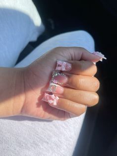 Long Nail Set Ideas, Blinged Out Duck Nails, Charm Placement On Nails, French Tip Bling Nails, White Nails With Charms, Acrylic Duck Nails, Duck Acrylic Nails, Short Nail Sets, Pink Duck Nails