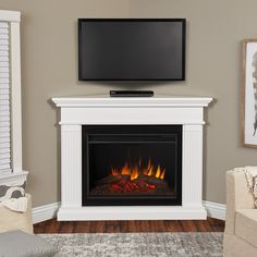 The Kennedy Grand corner electric fireplace will be the focal point for any room in your home. This fireplace features the Real Flame Grand series firebox, which is 30 percent larger than our standard firebox and has incredible realism and clarity. Hassle-free assembly and adjustable heat settings are just a few of the benefits of this classic fireplace. Available in white and dark walnut finishes. Real Flame 55.25-in W White Free Standing Fan-forced Corner Electric Fireplace with Remote Control Corner Electric Fireplace, Electric Fireplace With Mantel, Fireplace Style, Best Electric Fireplace, Portable Fireplace, Classic Fireplace, Electric Fireplaces, White Fireplace, Real Flame