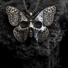 Transform your style with our stunning Butterfly Skull Necklace--a captivating blend of beauty and symbolism that will make a bold statement! Crafted from high-quality 925 sterling silver, this intricately designed necklace showcases a unique fusion of a delicate butterfly and a striking skull. Perfect for both men and women, it reflects a harmonious balance between gothic allure and nature-inspired elegance. Whether you're dressing up for a special occasion or adding flair to your everyday look Butterfly Skull, Delicate Butterfly, Gothic Necklace, Symbolic Jewelry, Skull Necklace, Matching Necklaces, Intricate Design, 925 Sterling Silver Jewelry, Resin Jewelry