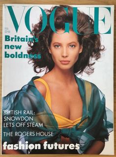 a magazine cover with an image of a woman wearing a yellow top and green scarf