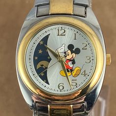 Vintage Mickey Mouse Rare Moon Phase Gold And Stainless Steel Watch By Sii Marketing (Seiko) Exclusive For Disney 1.25 Inch Case,Perfect Mineral Crystal, Gold Hands, Numbers And Markers Water-Resistant To 30 Meters Stunning 2 Tone 7 Inch Bracelet Runs New Battery Ships With A Spare Serviced Cleaned And Sanitized Disney Gold, Vintage Mickey Mouse, Phase 2, Vintage Mickey, Disney Accessories, Gold Hands, Steel Watch, Stainless Steel Watch, Moon Phases